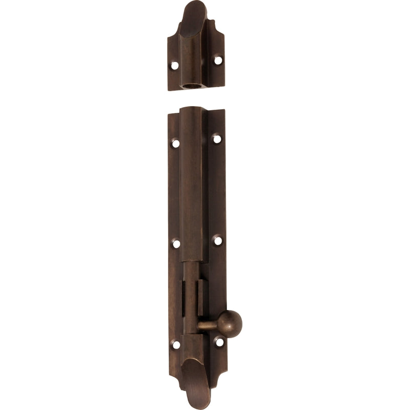 Tradco Victorian barrel bolt in brass with polished finish, mounted on a wooden door for secure latching.