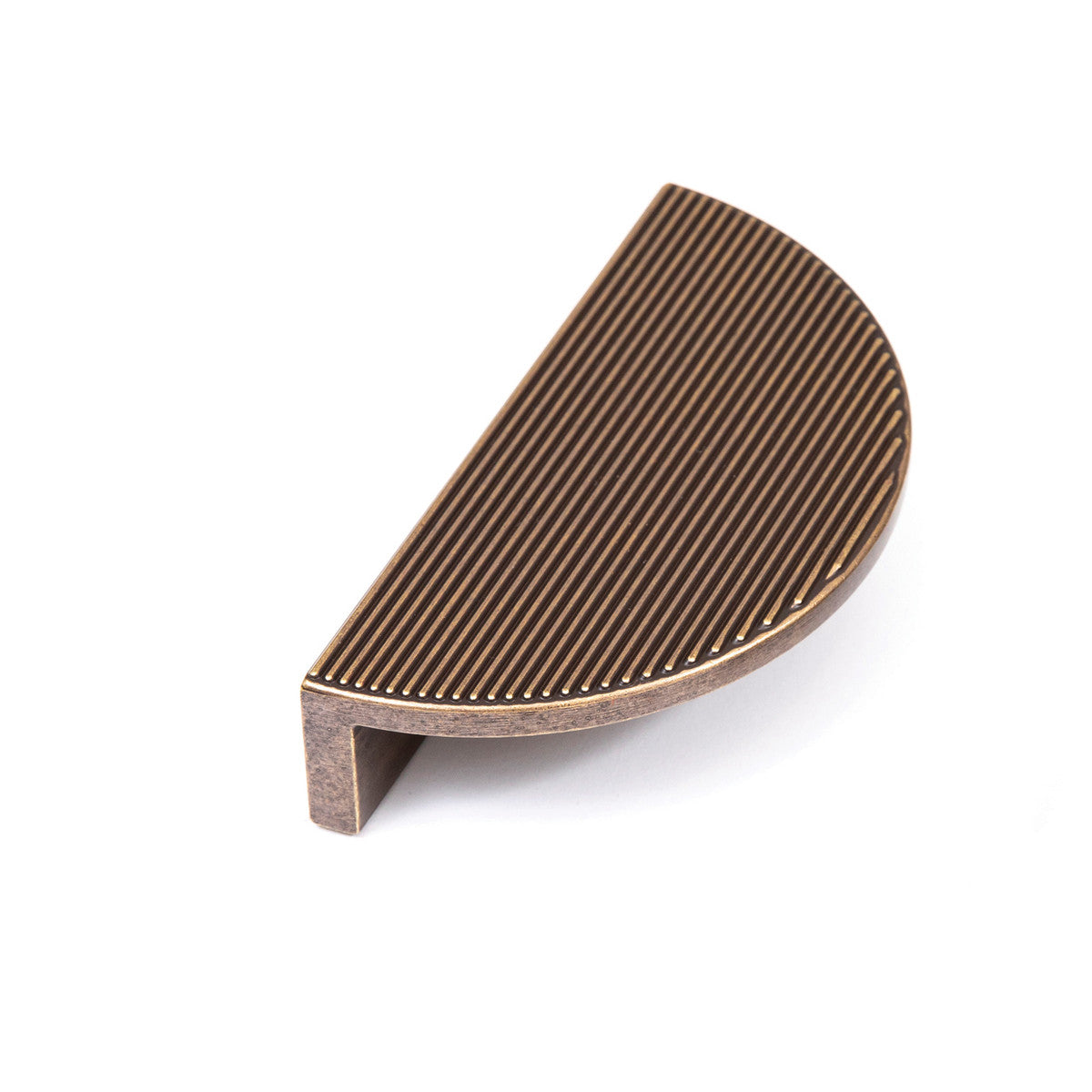 Momo Barrington Eclipse ribbed cabinet pull handle in brass finish mounted on a wooden cabinet door.