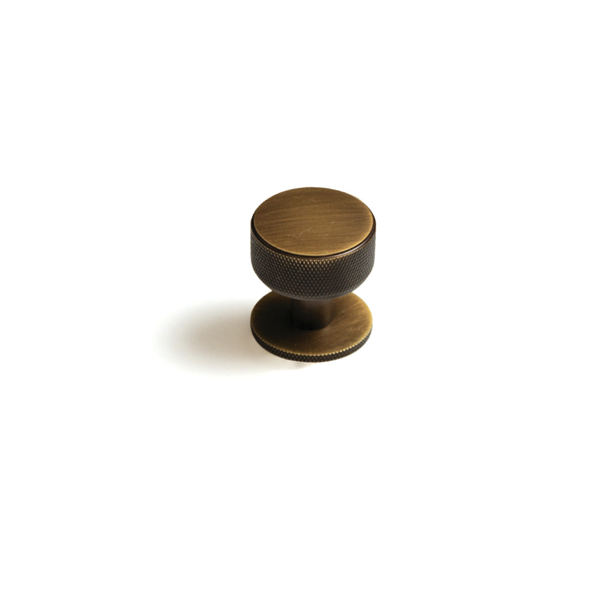 Momo Belgravia knurled cabinet knob in bronze finish, showing textured surface and round shape for modern furniture hardware.