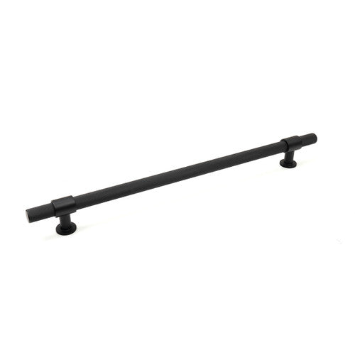 Momo Belgravia knurled appliance pull handle in matte black finish, mounted on a cabinet door, showcasing textured grip design.
