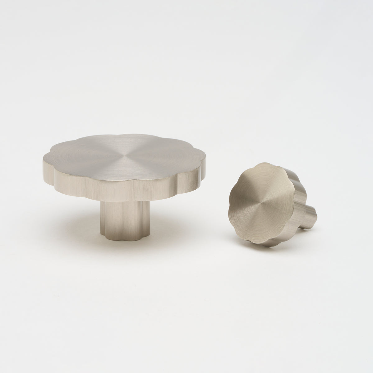 Lo & Co Tropez cabinet knob in brushed nickel finish, featuring a sleek, modern design for kitchen or bathroom cabinetry.