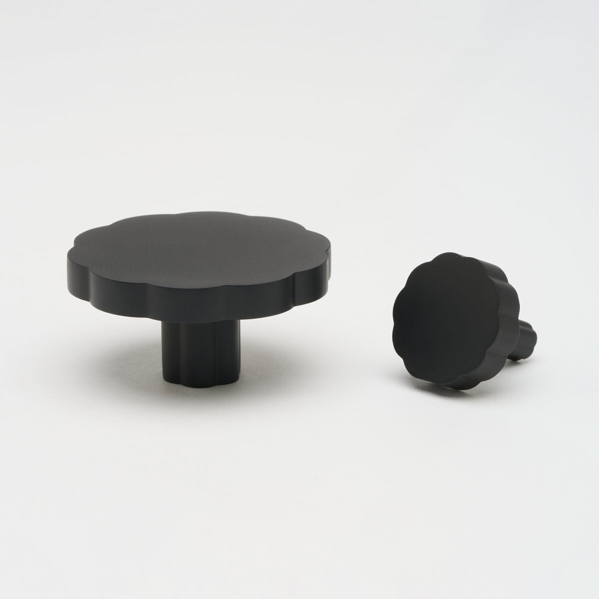 Lo & Co Tropez knob, a stylish cabinet hardware piece from Lo & Co Interiors, featuring a sleek, rounded design in a brushed finish.