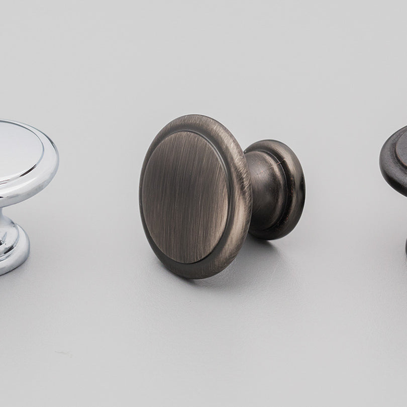 Kethy DK1357 cabinet knob in brushed bronze finish with a modern round design, ideal for kitchen or bathroom cabinets.