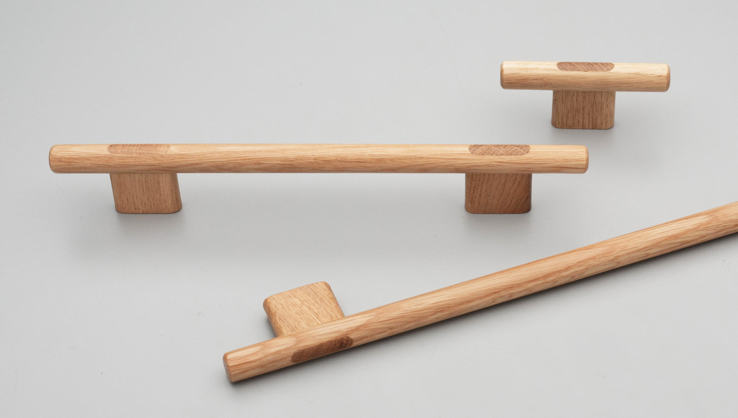Kethy L7819 Koge timber cabinet pull handle mounted on wooden cabinet door, featuring a sleek, modern design in natural wood finish.