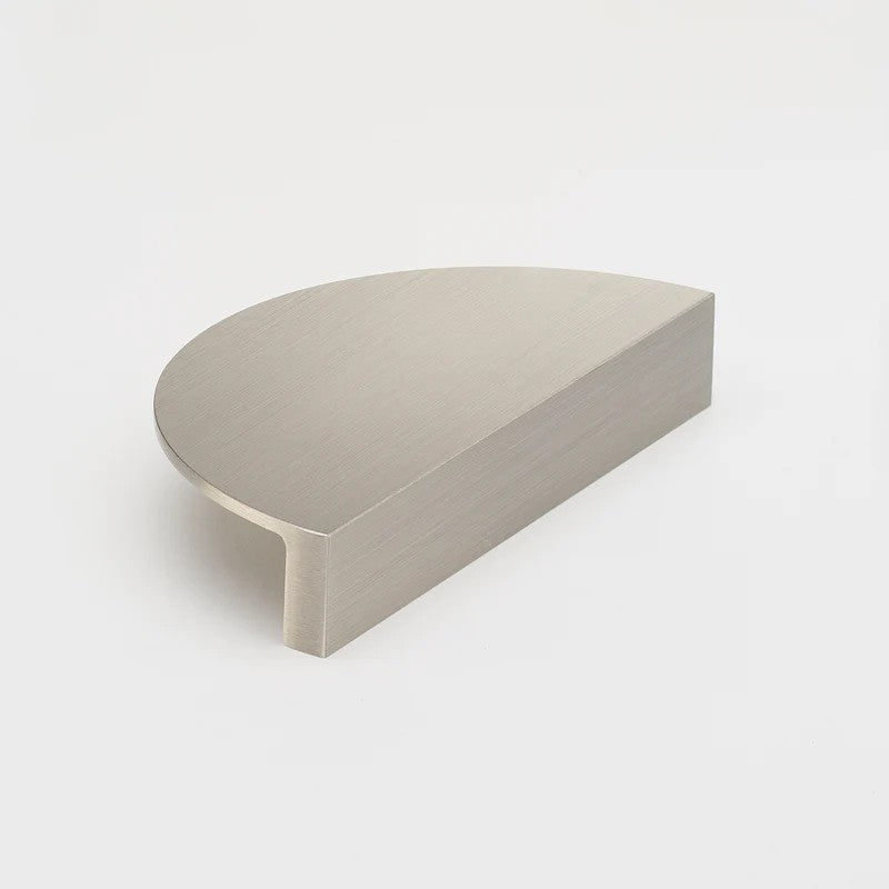 Lo & Co Luna Pull XL architectural hardware handle in polished brass, mounted on a door or cabinet.