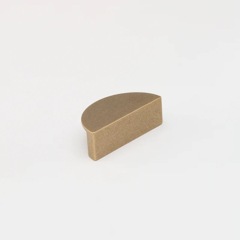 Lo & Co Luna Pull architectural hardware in a brushed bronze finish, featuring a sleek, modern design for cabinets or drawers.