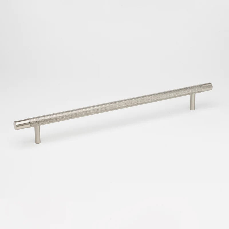 Brushed nickel Lo & Co Kintore appliance pull cabinet hardware mounted on a cabinet with a sleek, modern design.