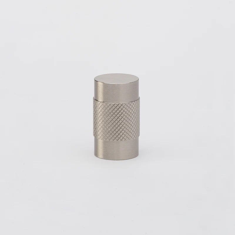 Brushed nickel Lo & Co Kintore architectural hardware knob mounted on a door or drawer
