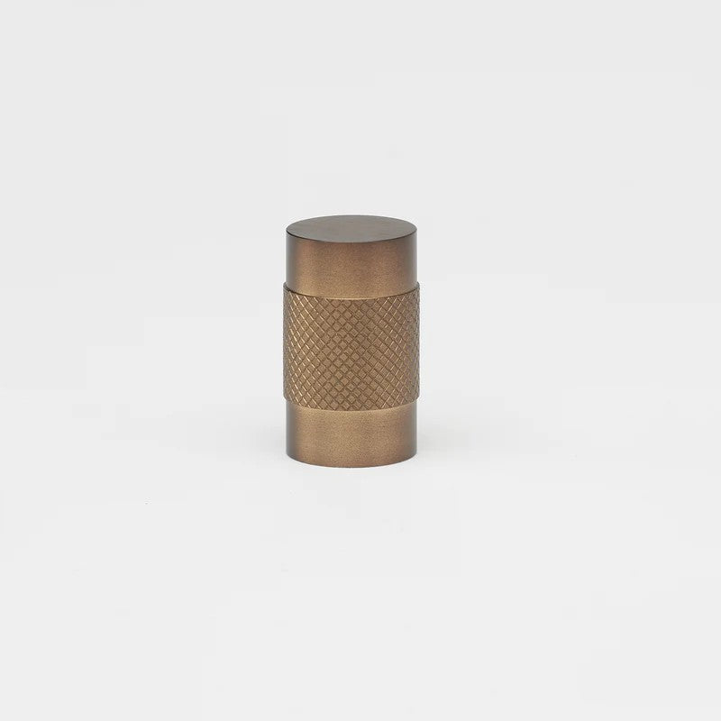 Brass Kintore Knob by Lo & Co Interiors, architectural hardware with a polished finish, mounted on a door or cabinet.