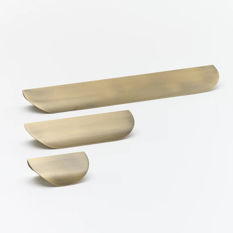 Lo & Co Carlisle Pull, elegant cabinet hardware handle in brushed antique brass finish, designed for kitchen or furniture cabinets