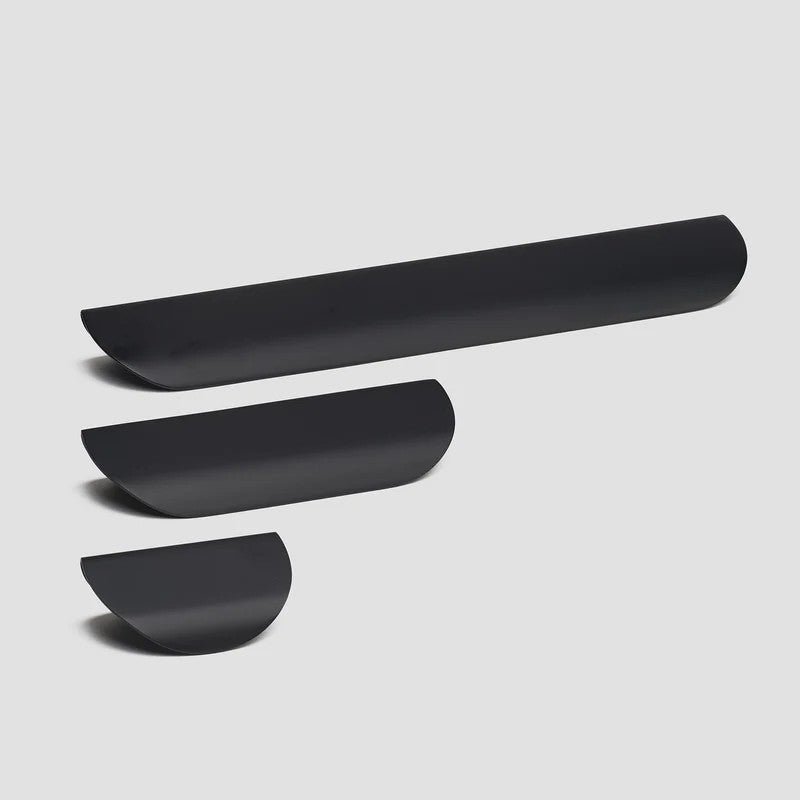Lo & Co Carlisle pull cabinet hardware in a sleek metallic finish, mounted on a cabinet door.