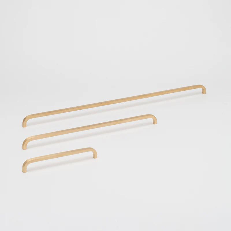 Lo & Co Interiors Curve Pull cabinet hardware in brushed nickel with sleek, curved design for modern kitchen or furniture.