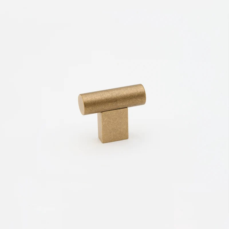 Lo & Co T-Knob architectural hardware in brushed metal finish, featuring a sleek, modern design for cabinetry or furniture.