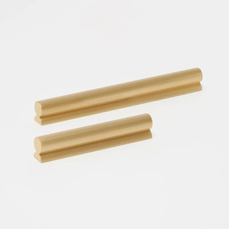 Lo & Co Fleur Pull cabinet hardware in antique brass finish, featuring an elegant floral design for stylish furniture accents.