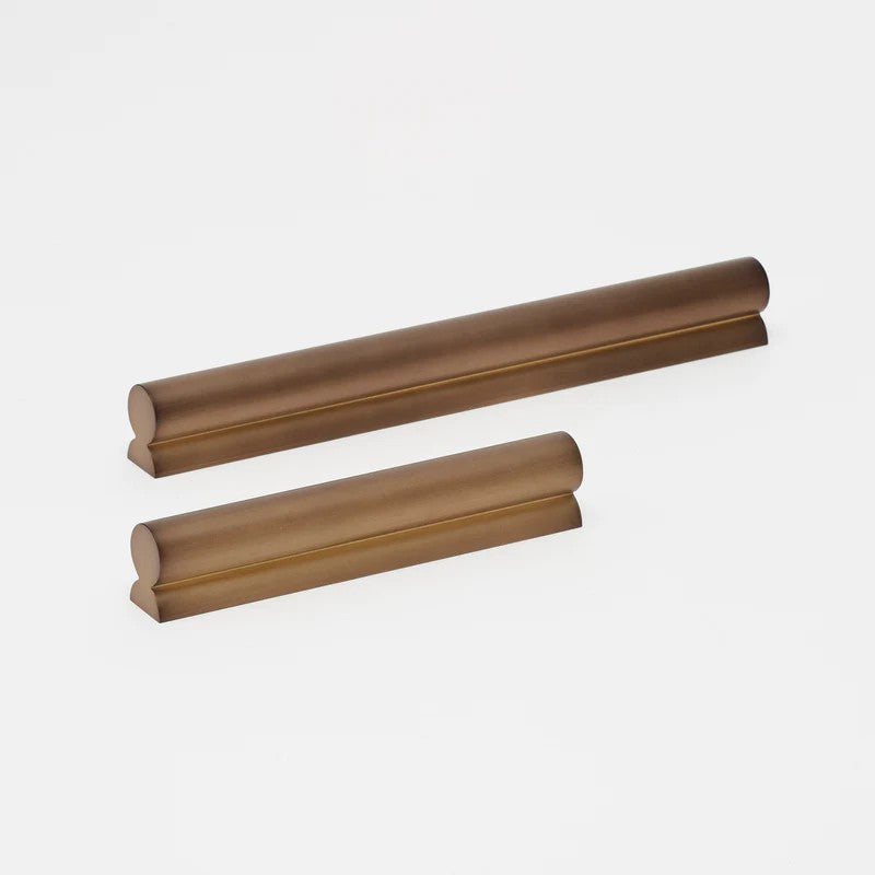 Lo & Co Fleur pull cabinet hardware in brushed bronze finish, elegant floral design for kitchen or furniture drawers.