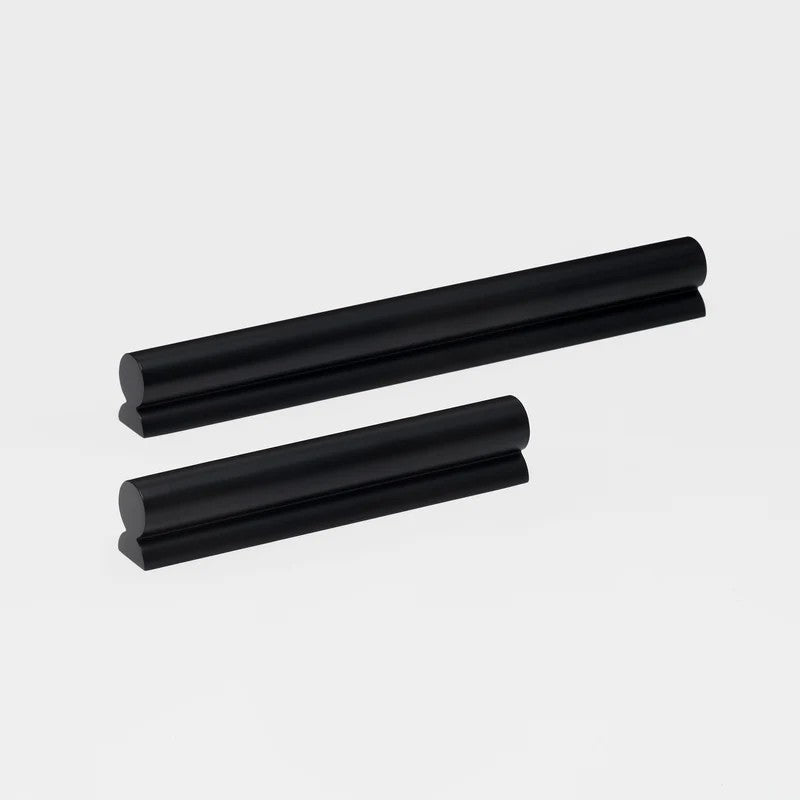Lo & Co Fleur Pull cabinet hardware in brushed nickel with floral design, mounted on a cabinet door.