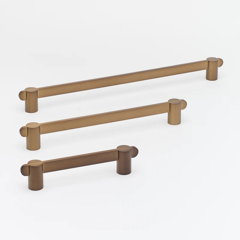Brass Lo & Co Intersect Pull handle on architectural hardware, featuring a modern, geometric design for doors or cabinetry.
