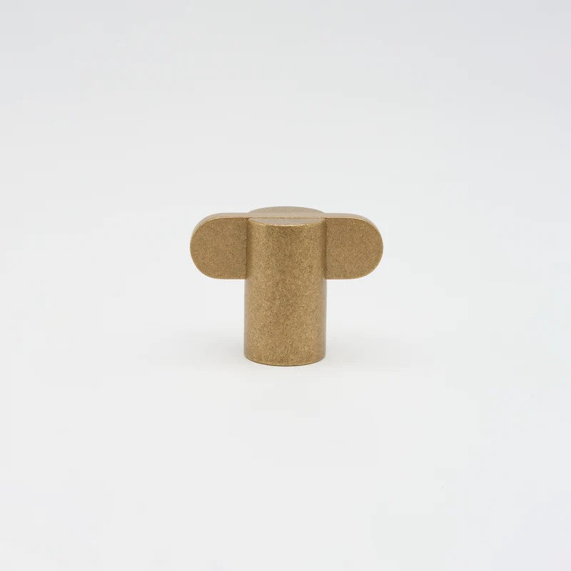 Lo & Co Intersect Knob, architectural hardware in a brushed bronze finish, mounted on a door or cabinet.