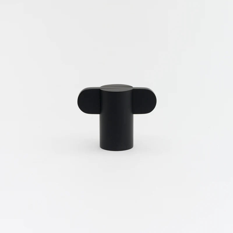 Lo & Co Intersect Knob, architectural hardware with a sleek metal finish, shown on a door handle in a modern interior setting.