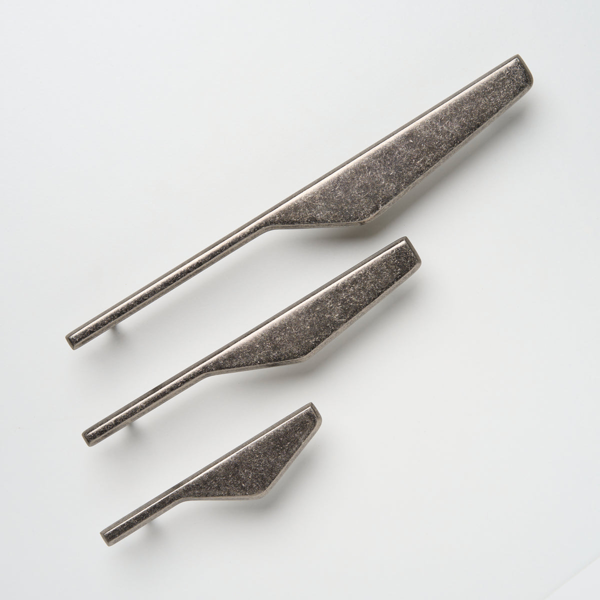 Lo & Co Outline Pull cabinet hardware, right-hand orientation, with a sleek C or D shape, in a bronze finish for modern cabinetry.