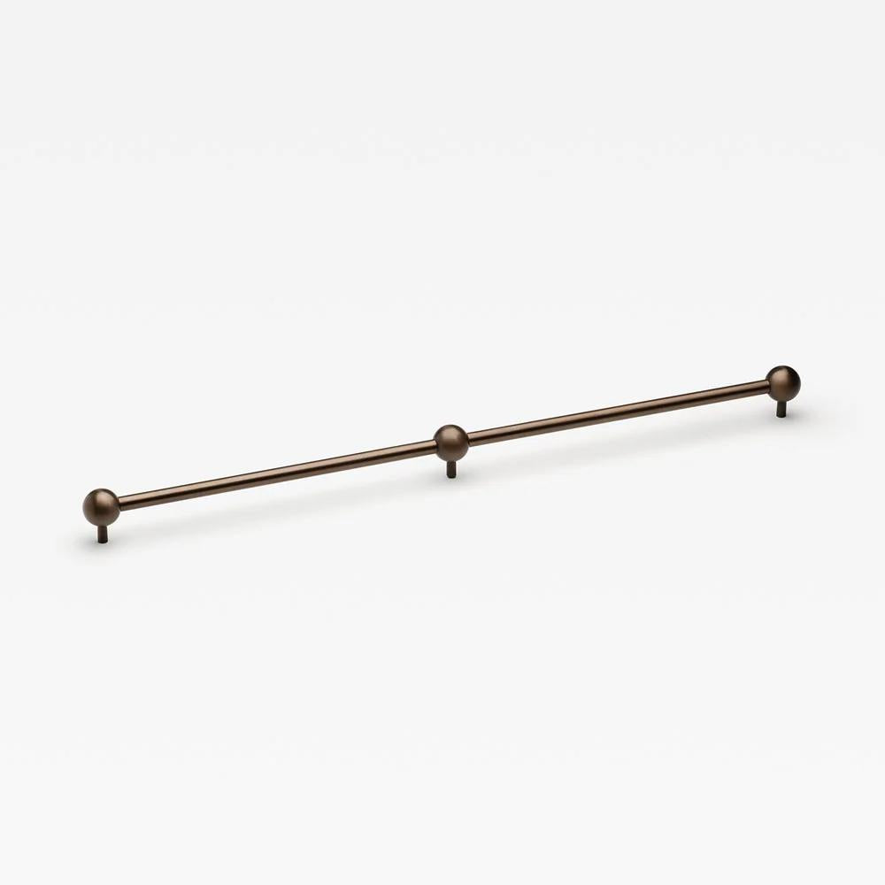 Lo & Co Sphere Appliance Pull cabinet hardware in oil-rubbed bronze finish mounted on a cabinet door.