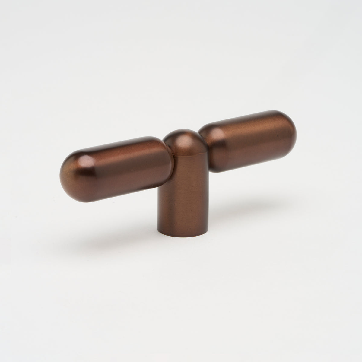 Lo & Co Tubby T-Pull cabinet hardware in brushed brass with a sleek T-shaped handle design.