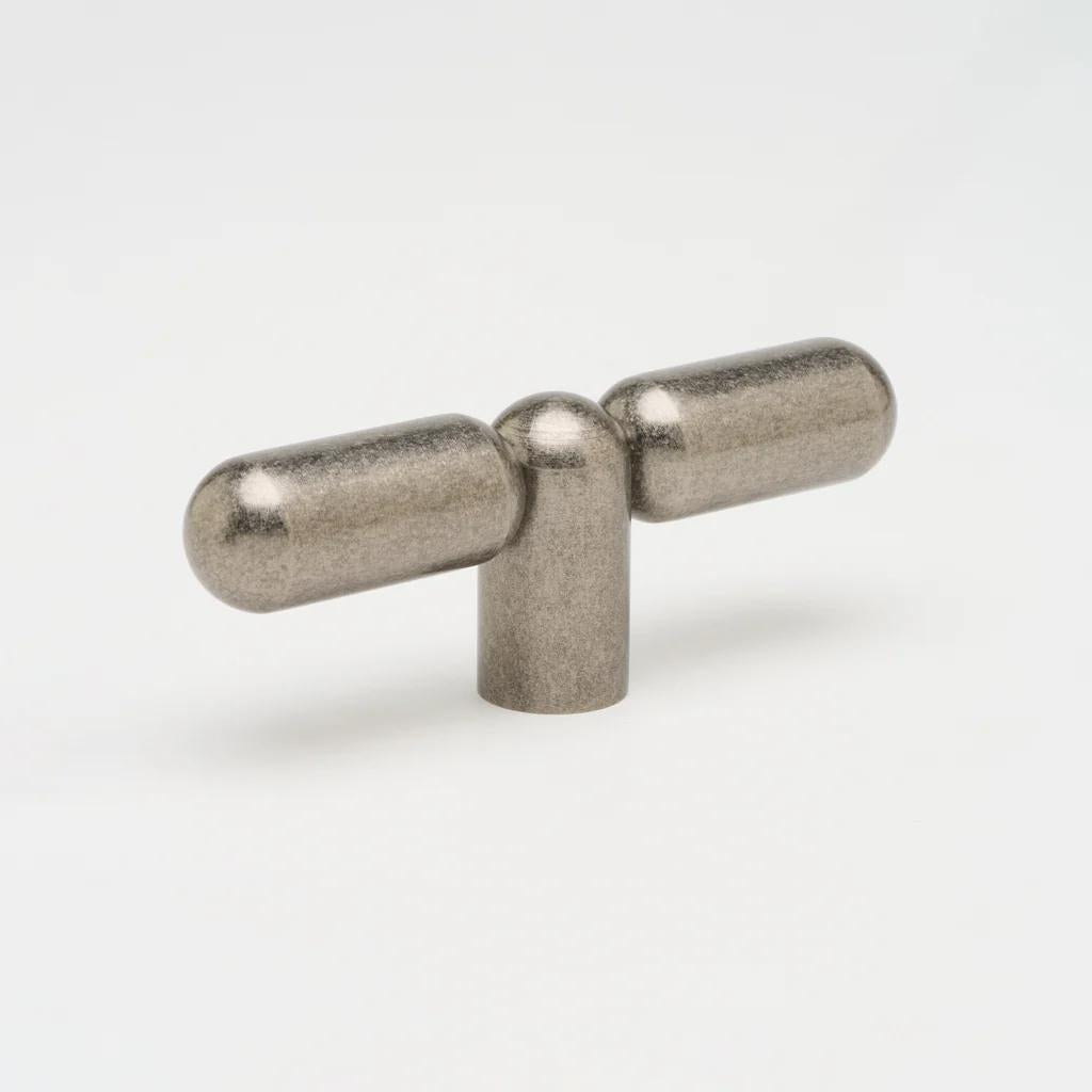 Lo & Co Tubby T-Pull cabinet hardware in a brushed nickel finish, featuring a modern T-shaped handle for kitchen or bathroom cabinets.