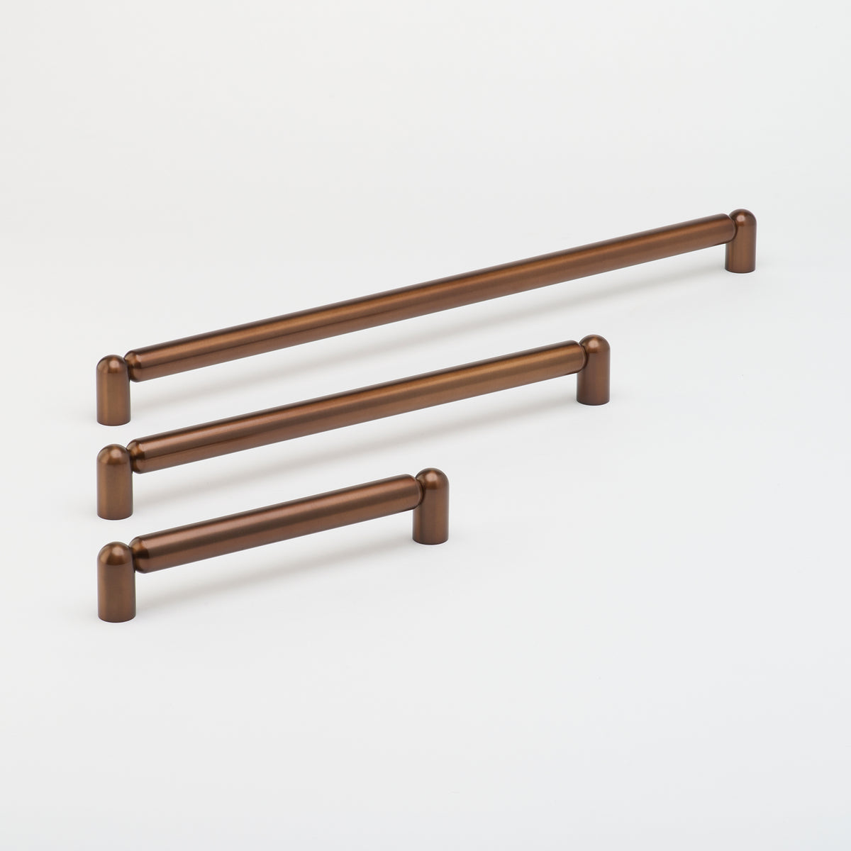 Lo & Co Tubby Pull Handle for cabinets, matte bronze finish, modern hardware with a sleek, rounded design.
