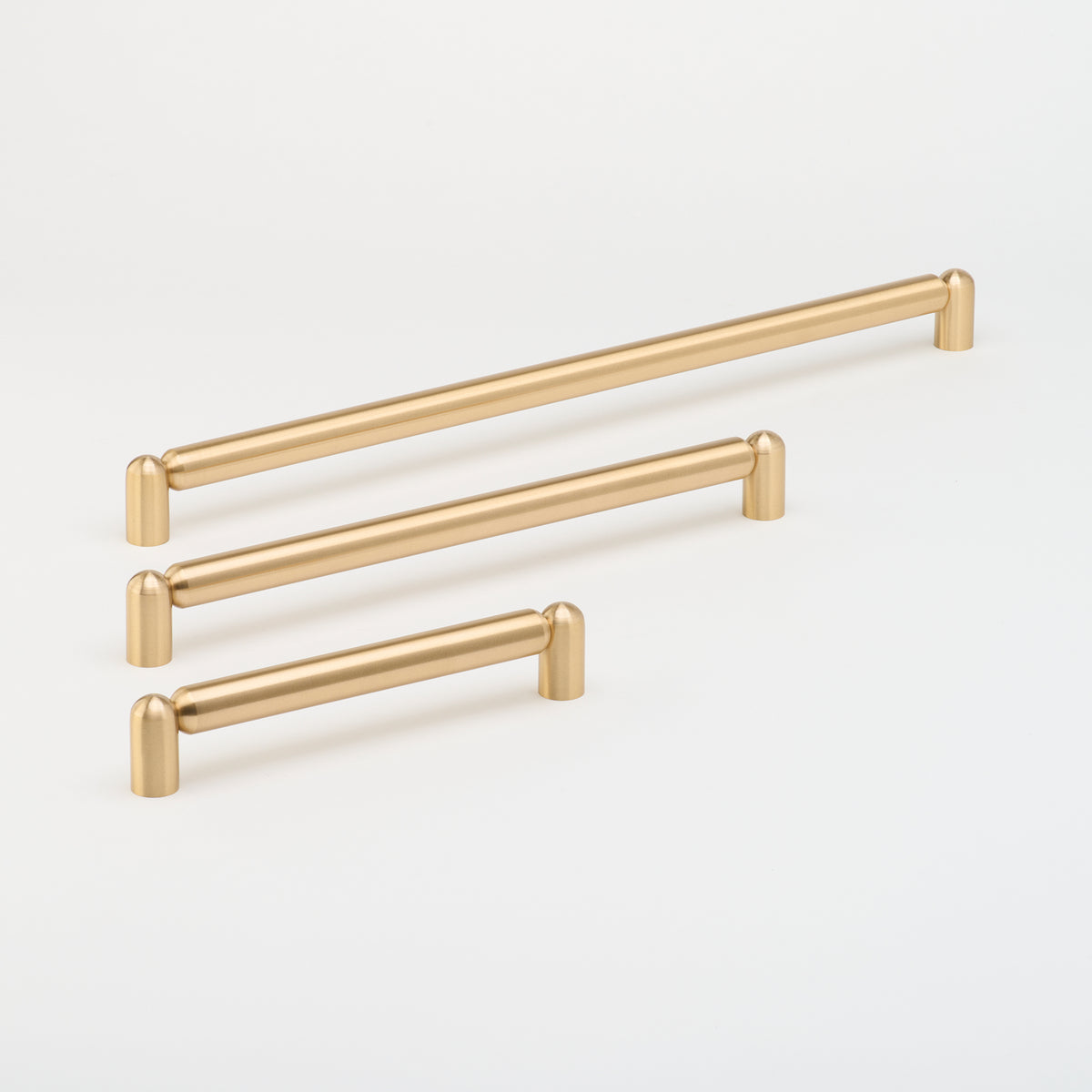 Lo & Co Tubby Pull Handle on cabinet hardware, brushed metal finish, modern design for kitchen or furniture drawers.