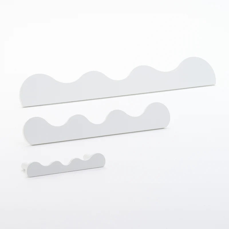 Lo & Co Interiors Karu Pull architectural hardware with sleek, modern design in a brushed finish, mounted on a door or cabinet.