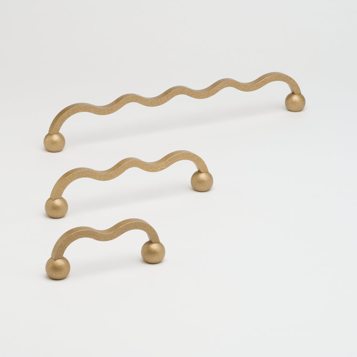 Lo & Co Interiors Capri Pull cabinet hardware in brushed bronze finish, showcasing sleek, modern handle design for kitchen or furniture.