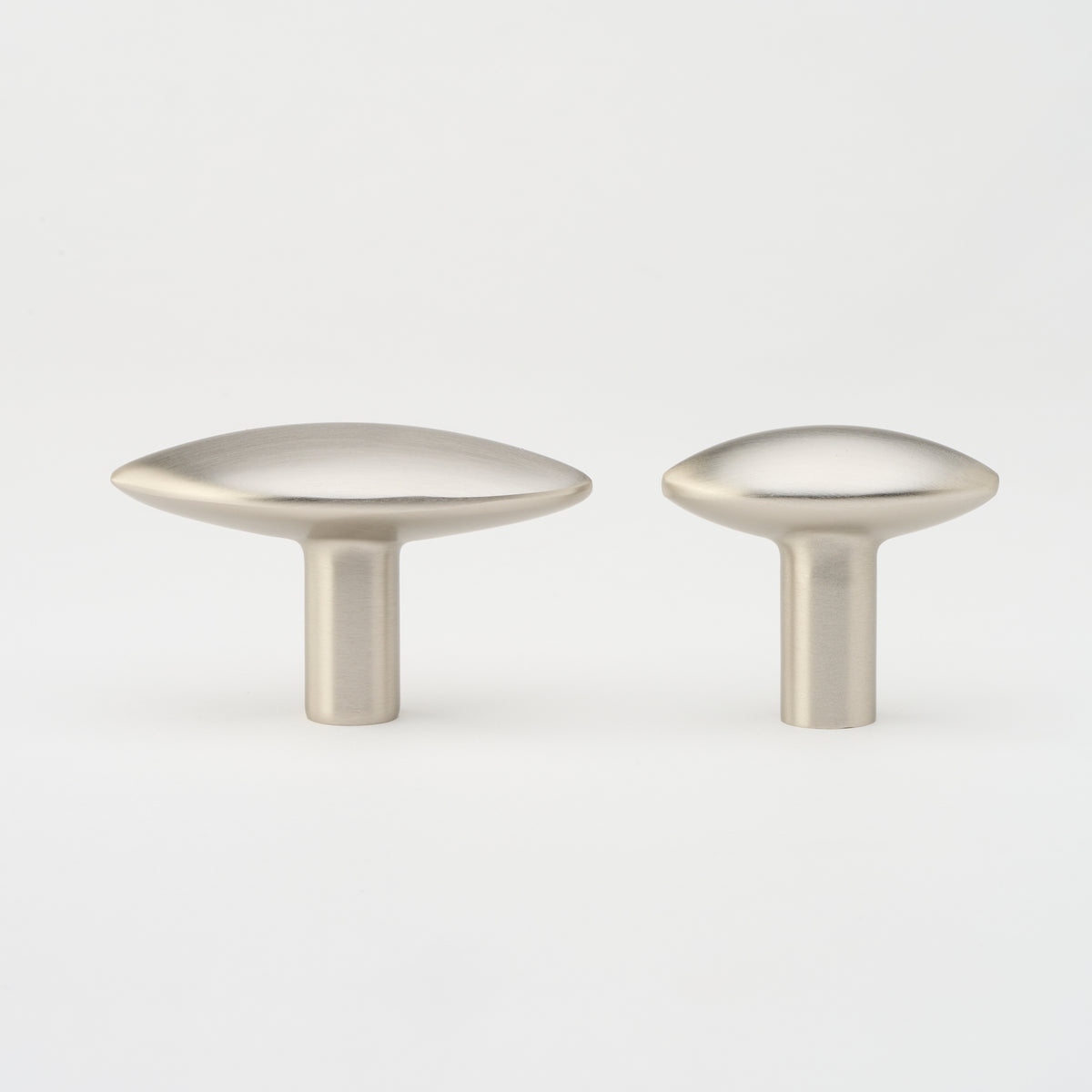 Lo & Co Almond Knob cabinet hardware in brushed nickel, featuring a smooth almond shape for kitchen or furniture drawers