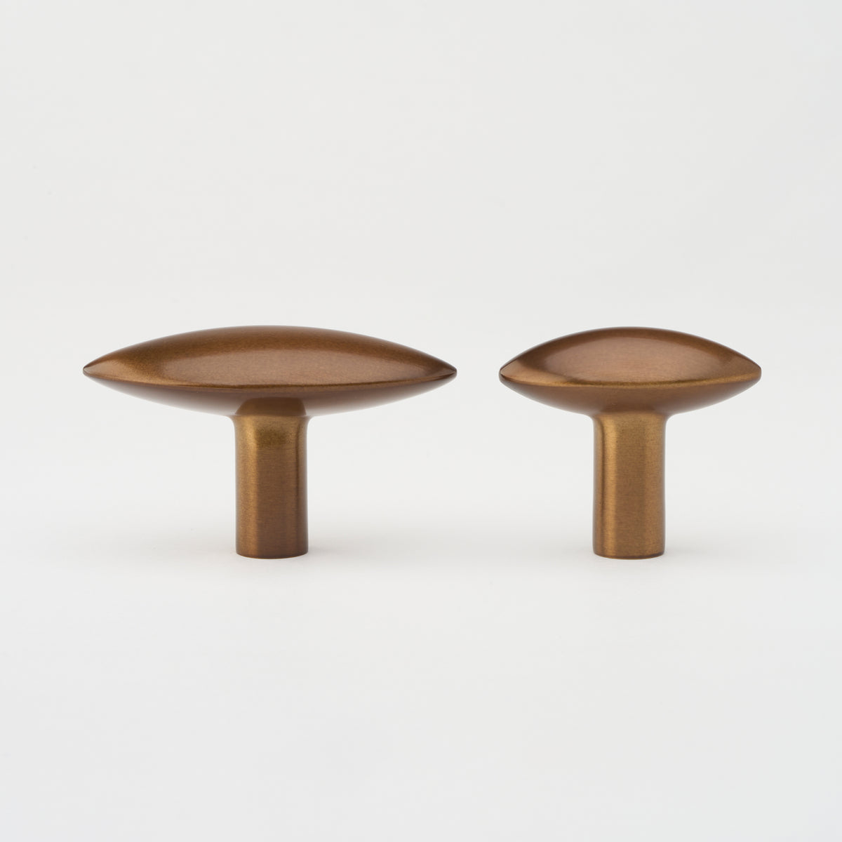 Lo & Co Almond Knob cabinet hardware in brushed bronze, featuring a smooth almond shape and modern design.