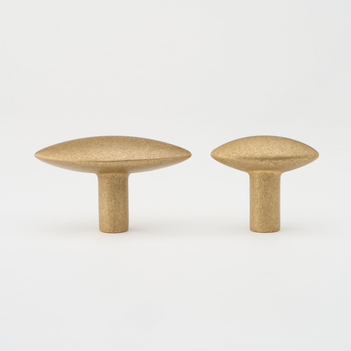 Lo & Co Almond knob cabinet hardware in brushed titanium finish, showing a close-up of the decorative drawer pull.