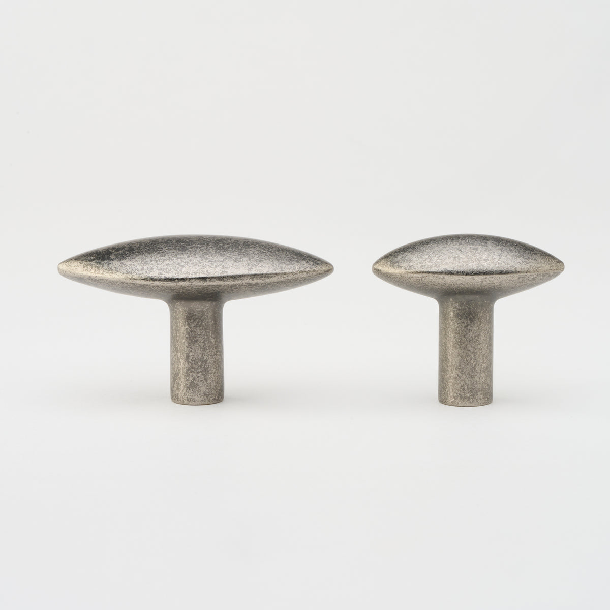 Lo & Co Almond Knob cabinet hardware in bronze finish, featuring a smooth almond-shaped design for furniture drawers and doors.