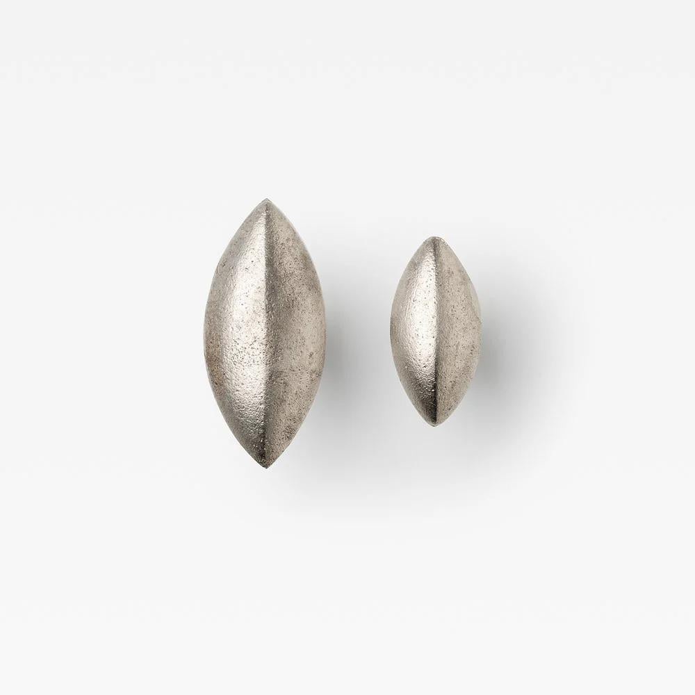 Lo & Co Cast Almond Cabinet Knob by Lo & Co Interiors, showing a close-up of the elegant almond-shaped hardware on a cabinet door.