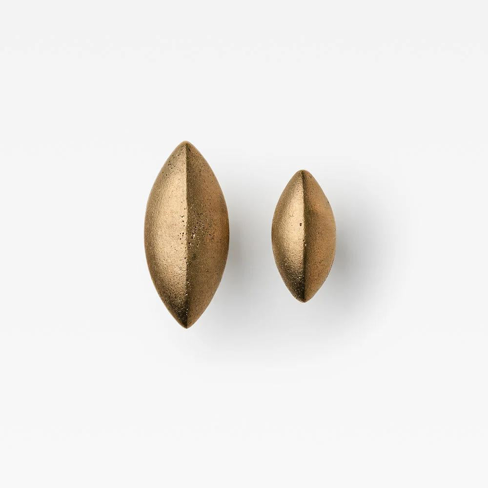 Lo & Co Cast Almond Cabinet Knob by Lo & Co Interiors, close-up of brushed nickel finish on elegant hardware knob.