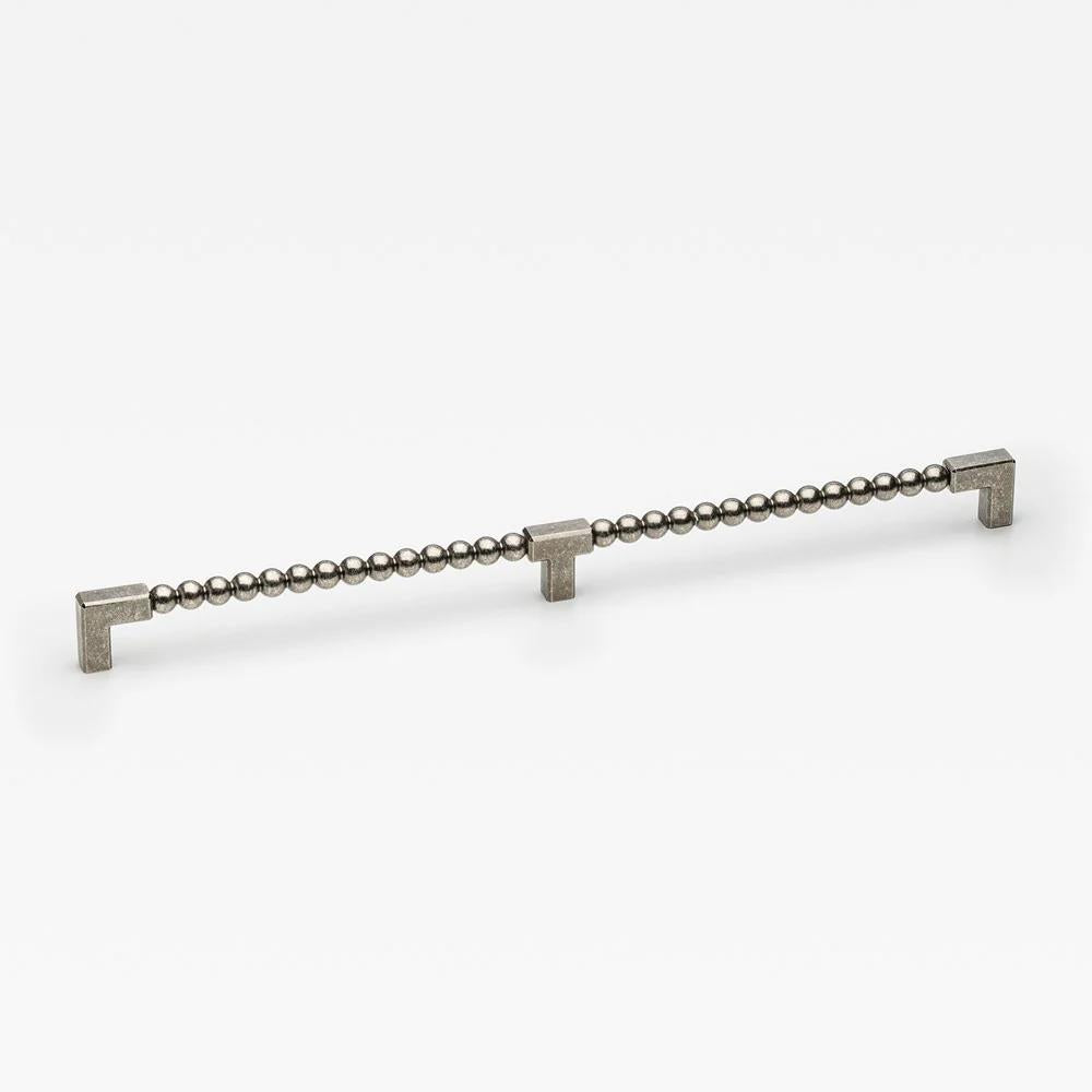 Large Lo & Co ORBE cabinet pull from Lo & Co Interiors, showcasing sleek bronze cabinet hardware with a modern design.