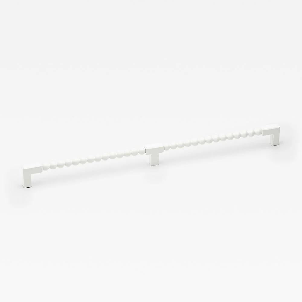 Large Lo & Co ORBE cabinet pull, modern hardware handle in a sleek finish, mounted on a cabinet door.