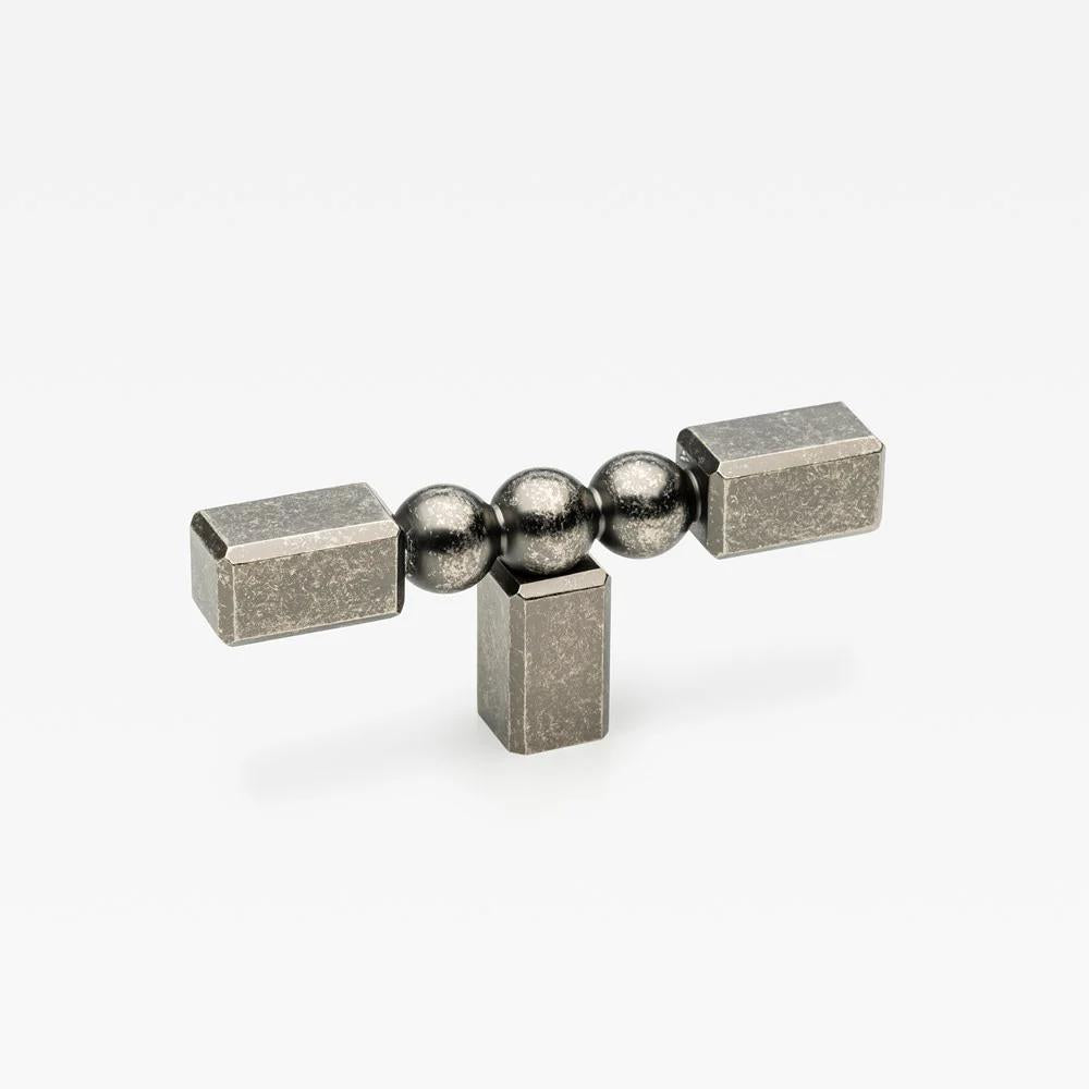 Small Lo & Co ORBE cabinet T-pull handle in bronze finish, designed for modern kitchen or furniture drawers.