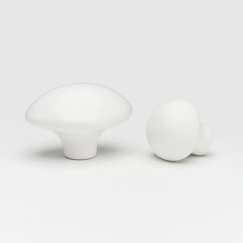 Ceramic pebble cabinet knob in light gray from Lo & Co Interiors, featuring smooth rounded design for furniture hardware.