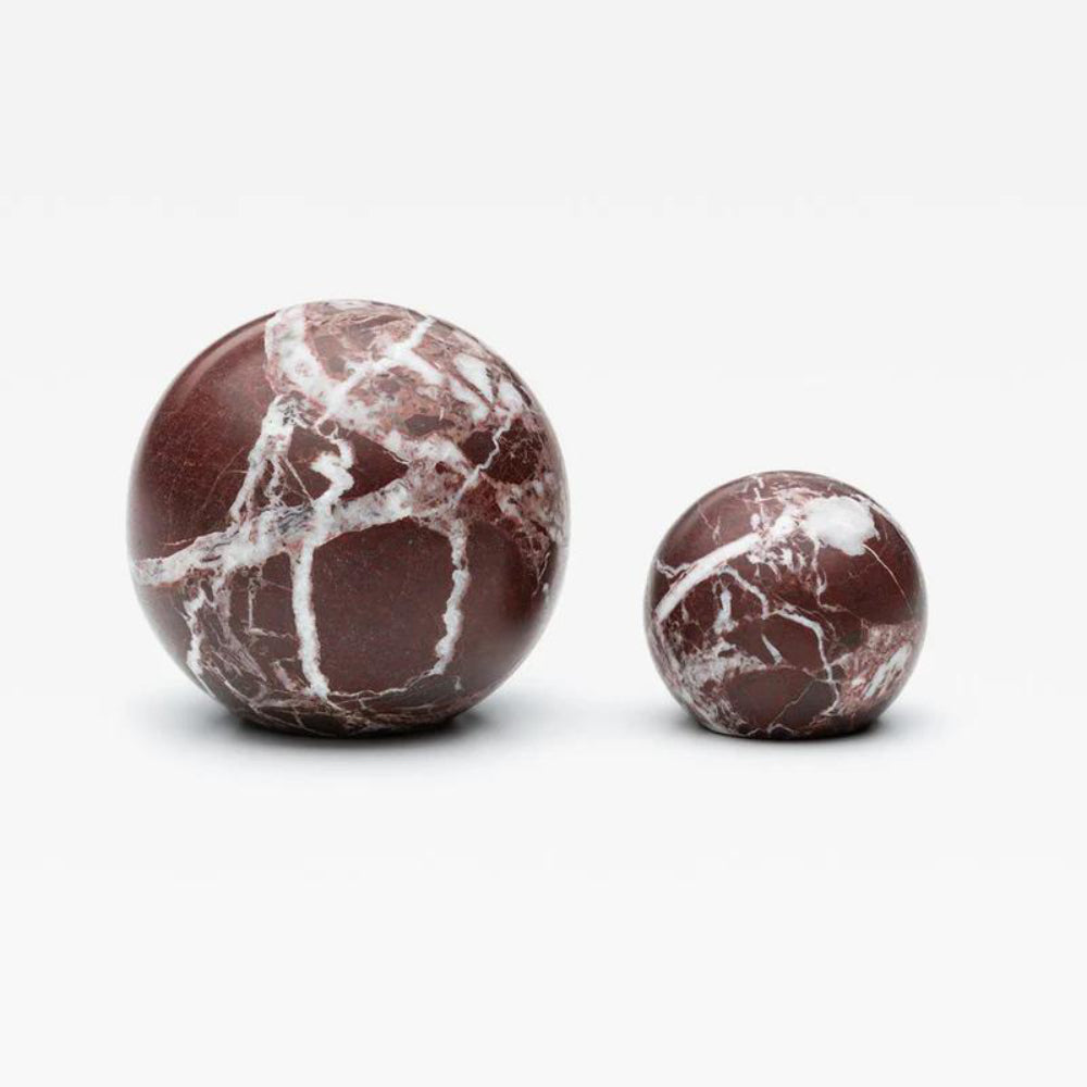Lo & Co Hubble Knob in marble, modern cabinet hardware with a sleek, rounded design for furniture accents.
