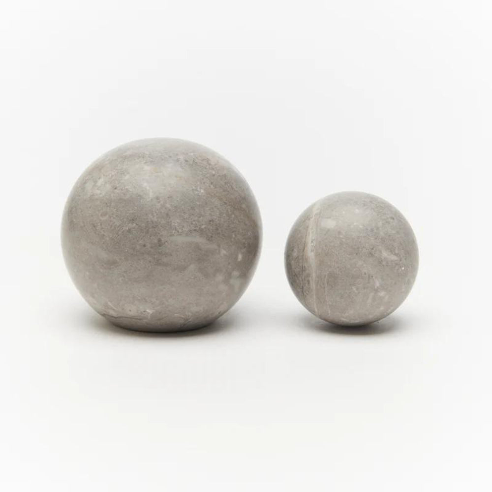 Lo & Co Hubble Knob in Tundra marble, stylish cabinet hardware with a smooth, rounded design for modern furniture.
