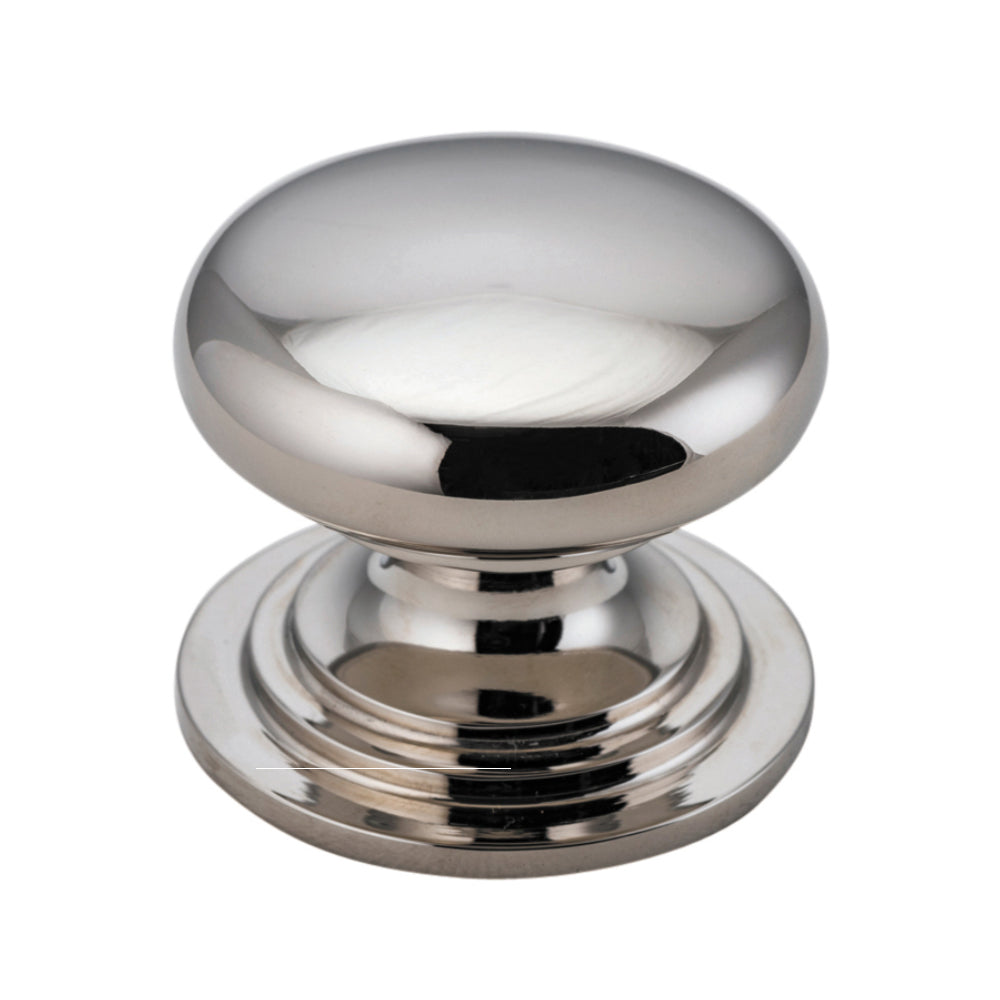Iver Sarlat Cupboard Knob, architectural hardware, with a classic bronze finish and ornate design, mounted on a wooden cabinet door.