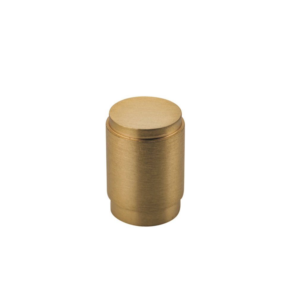 Iver Berlin cabinet knob in brushed nickel, featuring a sleek round design, mounted on a wooden cabinet door.