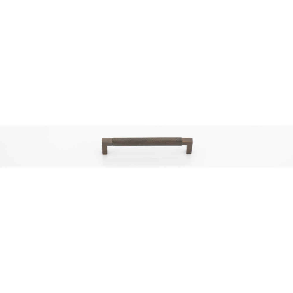 Iver Brunswick cabinet pull handle with a sleek, modern design, made of metal, mounted on a wooden cabinet.