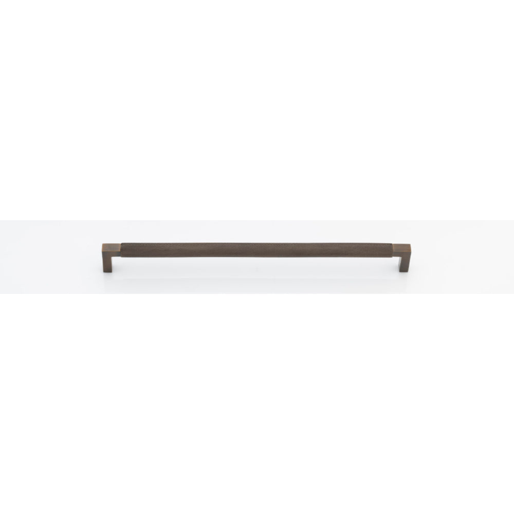 Iver Brunswick cabinet pull handle in brushed nickel with a sleek, modern design, mounted on a wooden cabinet.