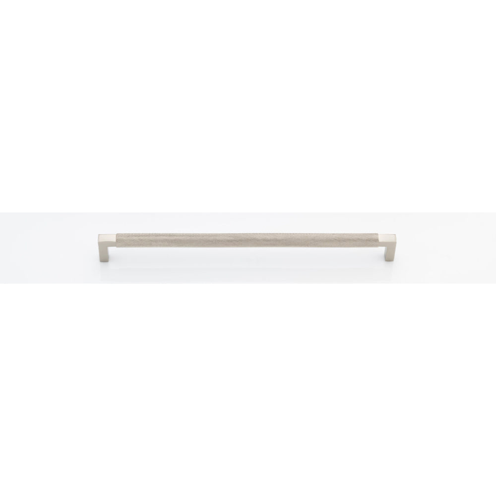 Iver Brunswick cabinet pull handle with a sleek, modern design, featuring a brushed metal finish on a wooden cabinet.