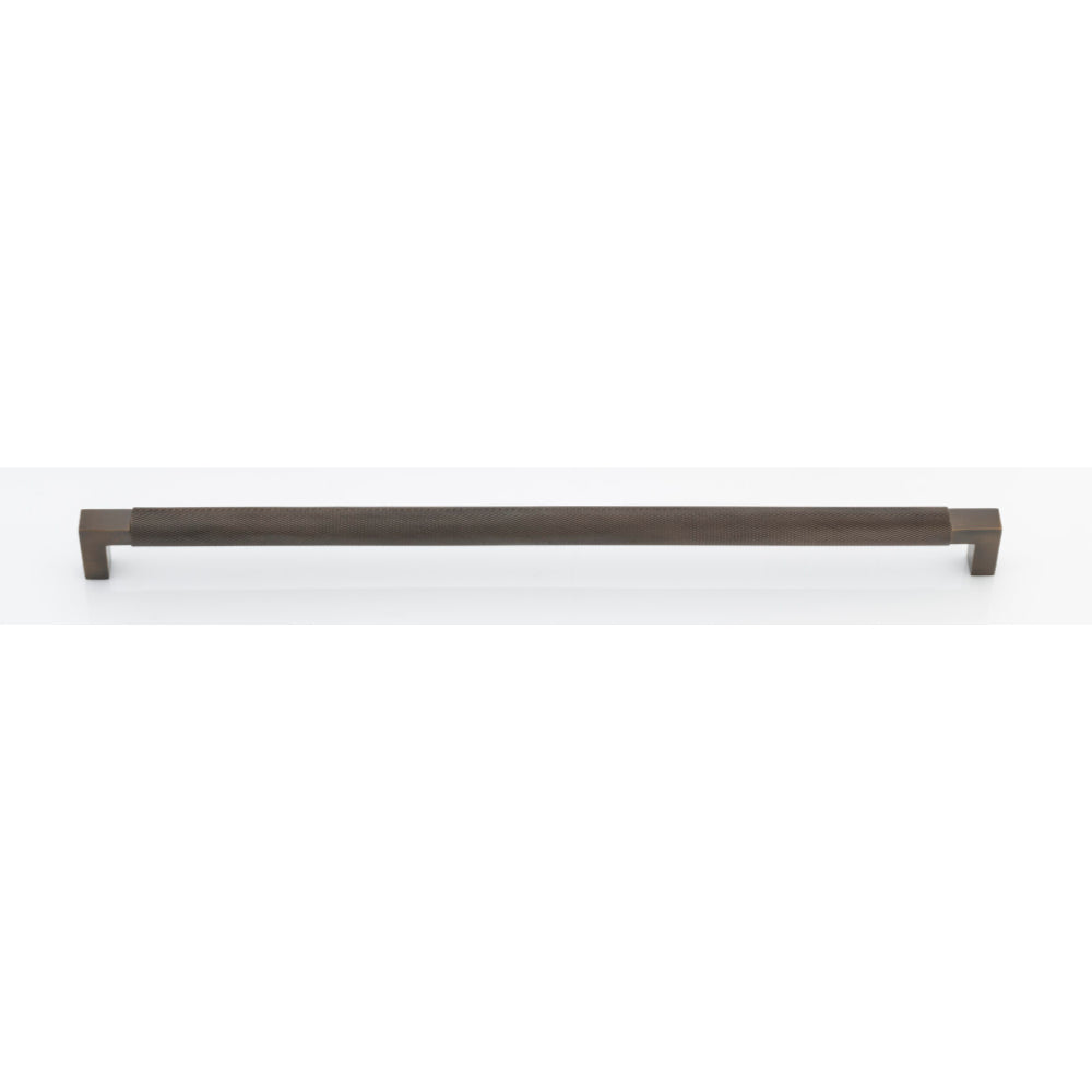 Iver Brunswick cabinet pull handle in brushed nickel finish, showing a sleek, modern design on a wooden cabinet.