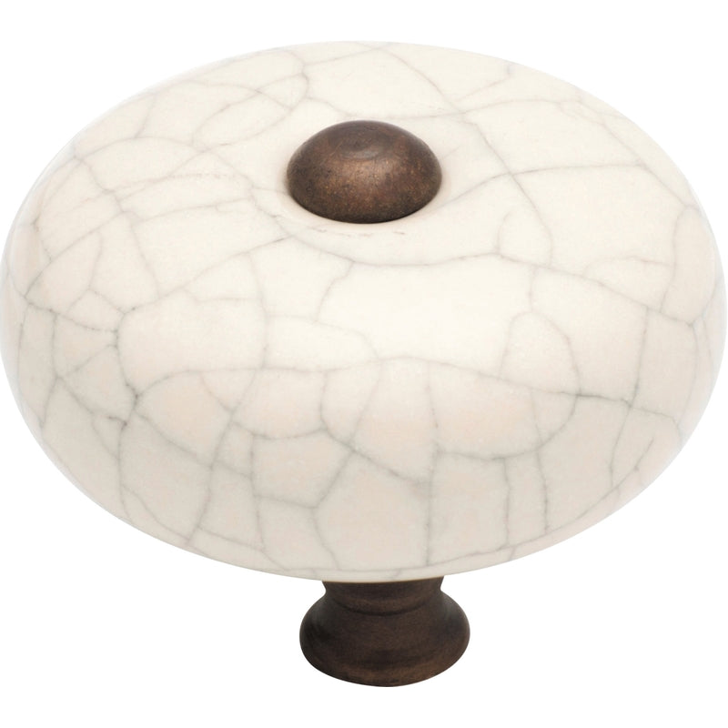 Tradco Crazed Round Cupboard Knob, architectural hardware with a textured, distressed finish, shown on a wooden cabinet.